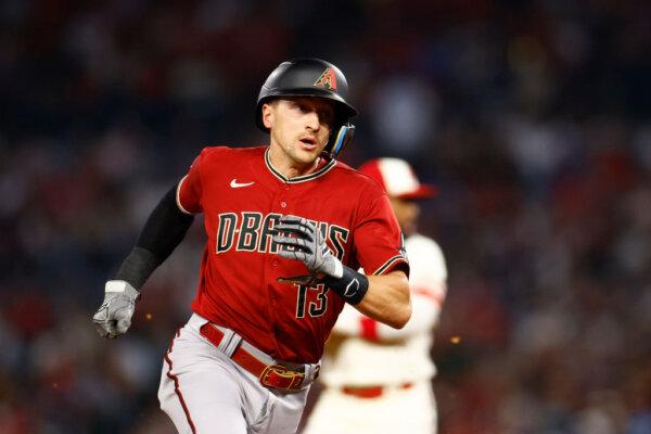 Nick Ahmed (13) of the Arizona Diamondbacks at Angel Stadium in Anaheim, Calif., on July 1, 2023. (Ronald Martinez/Getty Images)
