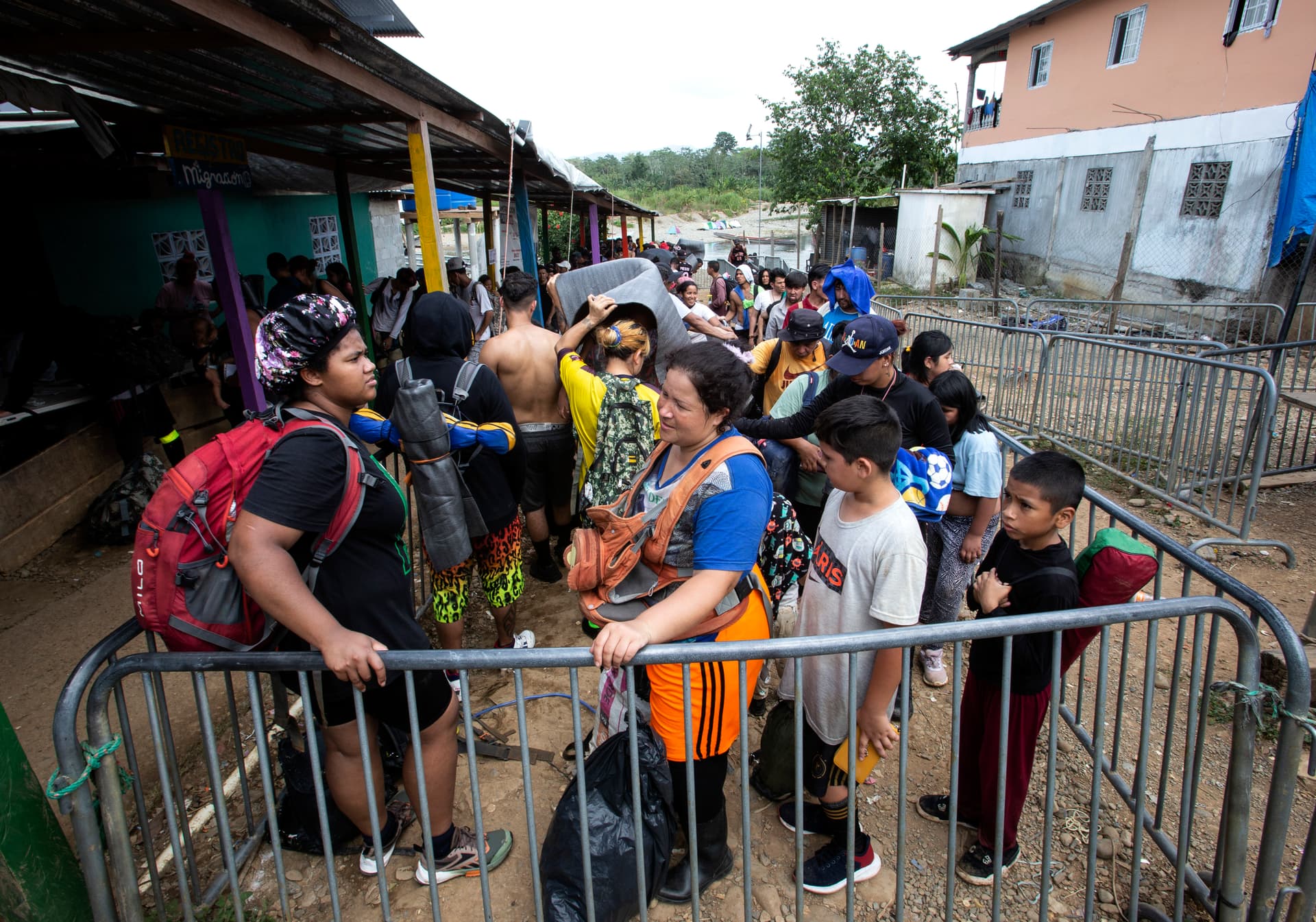Migrants at an immigration checkpoint after being ferried by canoe to Bajo Chiquito, Panama, on Feb. 18, 2024. Bajo Chiquito is the first migrant camp after crossing the Darien Gap from Colombia into Panama. (Bobby Sanchez for The Epoch Times)