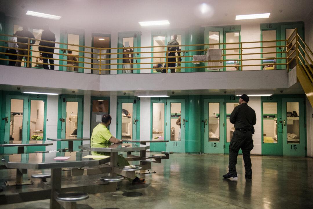 A sheriff's deputy (R) talks to an illegal immigrant detainee (L) in a high security housing unit at the Theo Lacy Facility in Orange, Calif., on March 14, 2017. (Robyn Beck/AFP via Getty Images)