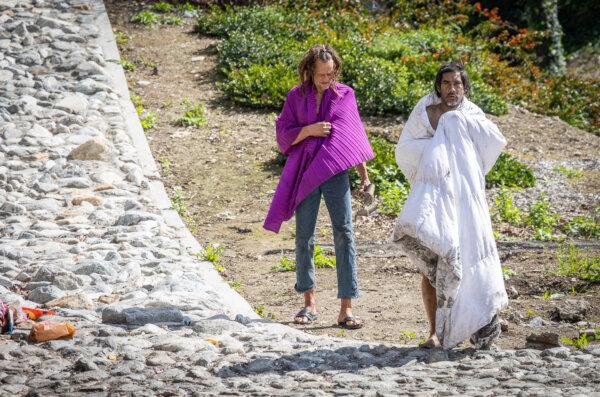 Homeless men walk the streets of Los Angeles on March 4, 2024. (John Fredricks/The Epoch Times)