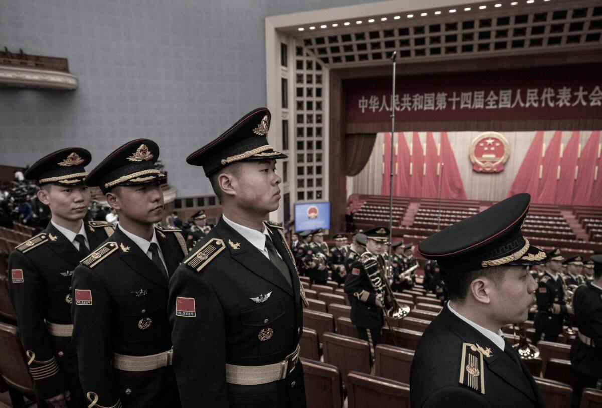 People's Liberation Army Band members leave after the opening of the NPC, or National People's Congress, at the Great Hall of the People in Beijing on March 5, 2024. (Kevin Frayer/Getty Images)