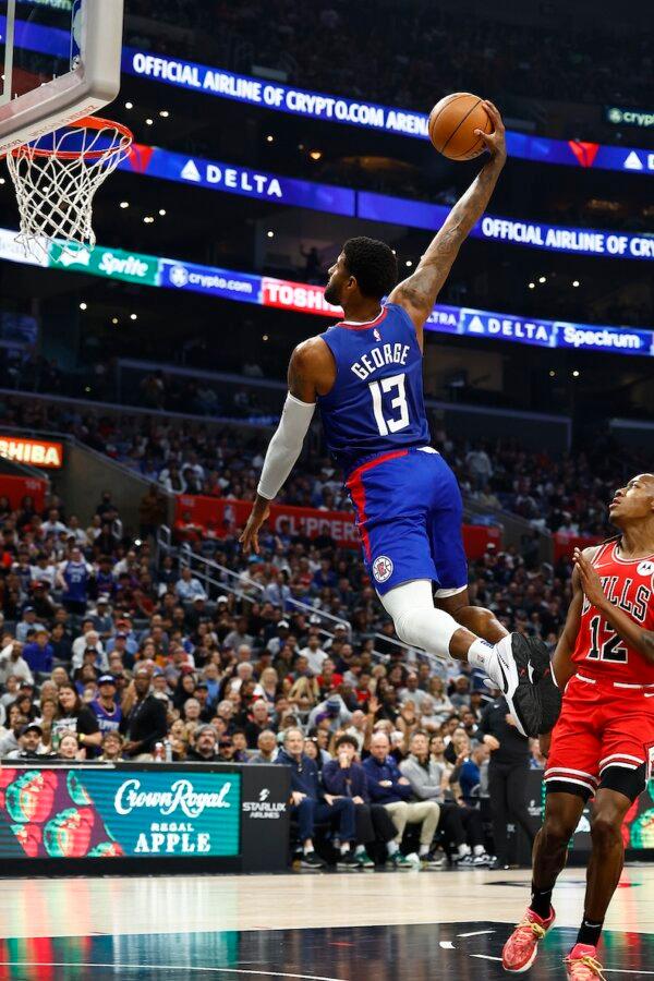 Paul George (13) of the LA Clippers makes a slam dunk against the Chicago Bulls in the first half in Los Angeles on March 9, 2024. (Ronald Martinez/Getty Images). (Ronald Martinez/Getty Images)