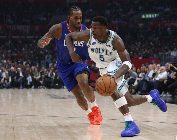 Anthony Edwards (5) of the Minnesota Timberwolves drives to the basket on Kawhi Leonard (2) of the LA Clippers during the first half in Los Angeles on March 12, 2024. (Harry How/Getty Images)