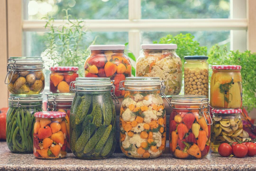 Frozen and canned vegetables have nearly the same nutritional value as fresh vegetables. After buying groceries in bulk, it’s easy to freeze and can the surplus produce at home. (BravissimoS/Shutterstock; kajakiki/E+/Getty Images)