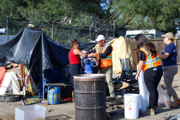 People are cleared from a homeless encampment in Los Angeles. (Courtesy of Inside Safe)