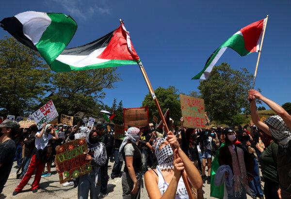 University of California, Santa Cruz graduate students and other academic workers in the UAW 4811 union begin a strike and are joined by UCSC students for Justice in Palestine as they picket the main entrance to campus in Santa Cruz, Calif., on May 20, 2024. (Shmuel Thaler/The Santa Cruz Sentinel via AP)