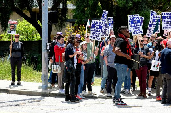 University of California, Santa Cruz graduate students and other academic workers in the UAW 4811 union begin a strike and are joined by UCSC students for Justice in Palestine as they picket the main entrance to campus on Monday, May 20, 2024, in Santa Cruz, Calif. (Shmuel Thaler/The Santa Cruz Sentinel via AP)