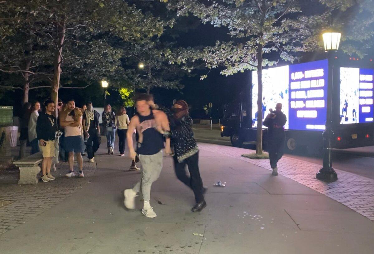 A Jewish man is attacked by a pro-Palestinian protester in New York on May 6, 2024. (Enrico Trigoso/The Epoch Times)
