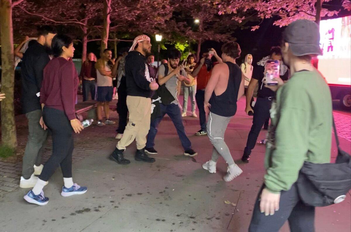 A Jewish man is confronted by pro-Palestinian protesters in New York on May 6, 2024. (Enrico Trigoso/The Epoch Times)