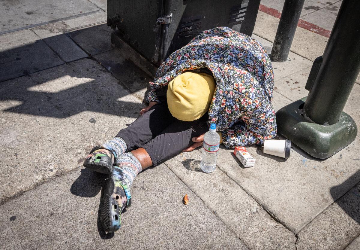 A homeless person under the influence of drugs in San Francisco’s Tenderloin district on May 16, 2024. (John Fredricks/The Epoch Times)