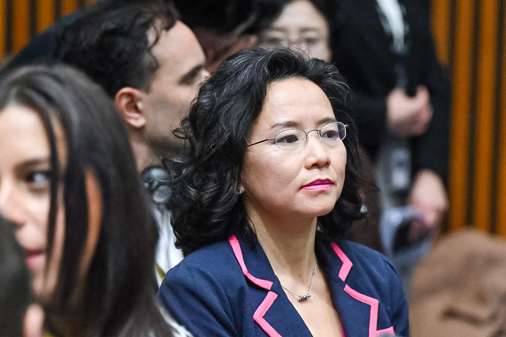 Australian journalist Cheng Lei observes a signing ceremony by China's Premier Li Qiang and Australia's Prime Minister Anthony Albanese at the Australian Parliament House in Canberra, Australia, on June 17, 2024. (Lukas Coch/POOL/AFP via Getty Images)