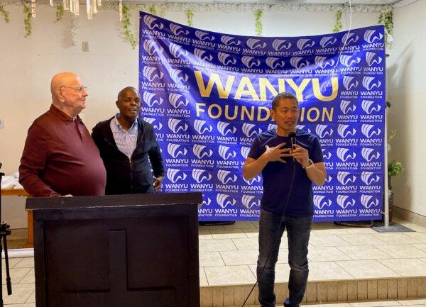 Eric Ching, chief executive officer of the foundation and a Walnut city councilor, speaks at the Wanyu charity event in Bell, Calif., on June 12, 2024. (Shawn Ma/The Epoch Times)