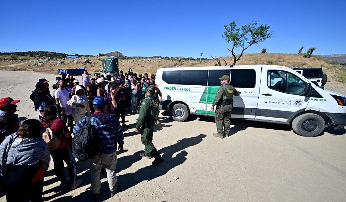 Customs and Border Protection officers arrive with a vehicle after a group of illegal immigrants walked from Mexico into the United States at Jacumba Hot Springs, Calif., on June 5, 2024. (Frederic J. Brown/AFP via Getty Images)