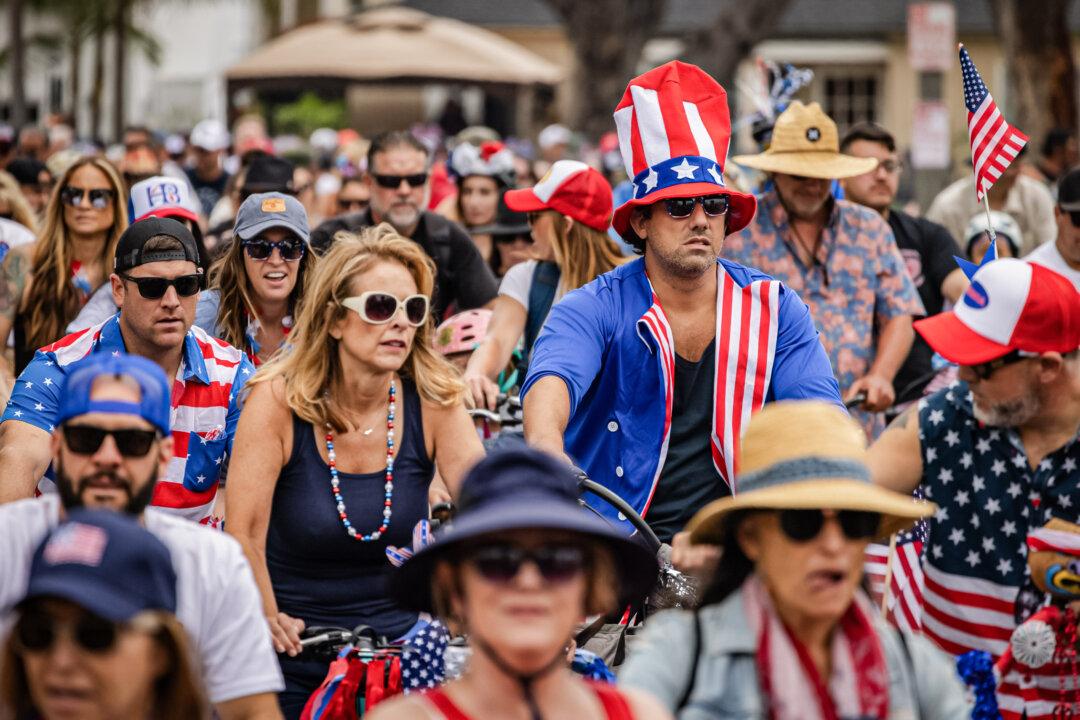 Locals take part in the annual Fourth of July Bicycle Cruise in Huntington Beach, Calif., on July 1, 2023. A majority of Americans (55 percent) think the United States has become a less patriotic nation than it was a few years ago. (John Fredricks/The Epoch Times)