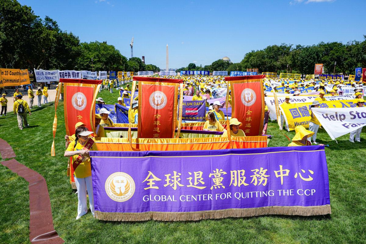 Falun Gong adherents take part in a rally calling for the end of the Chinese Communist Party’s 25 years of ongoing persecution of Falun Gong practitioners in China at the National Mall in Washington on July 11, 2024. (Larry Dye/The Epoch Times)
