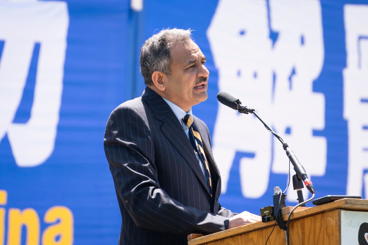 Asif Mahmood, U.S. Commission on International Religious Freedom commissioner, speaks during a rally calling for the end of the Chinese Communist Party’s 25 years of ongoing persecution of Falun Gong practitioners in China at the National Mall in Washington on July 11, 2024. (Madalina Vasiliu/The Epoch Times)