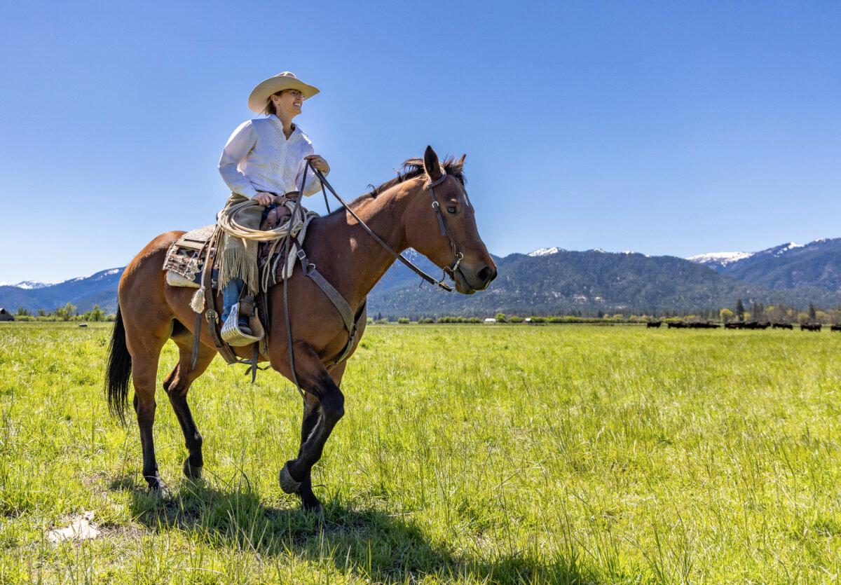 Theodora Johnson rides a horse on her ranch near the Scott River on May 8, 2024. (John Fredricks/The Epoch Times)