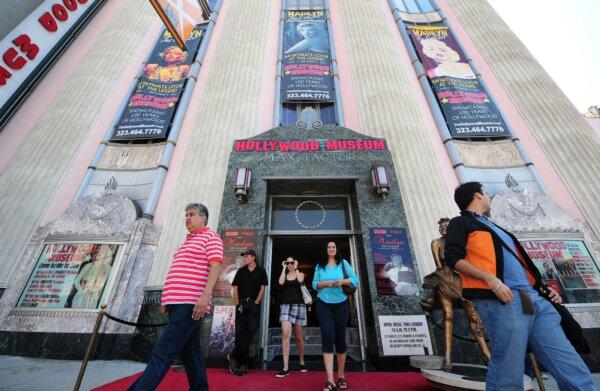 Tourists visit the Hollywood Museum where an exhibit on the life of Marilyn Monroe is taking place in Los Angeles on July 28, 2012. (Frederic J. Brown/AFP via Getty Images)