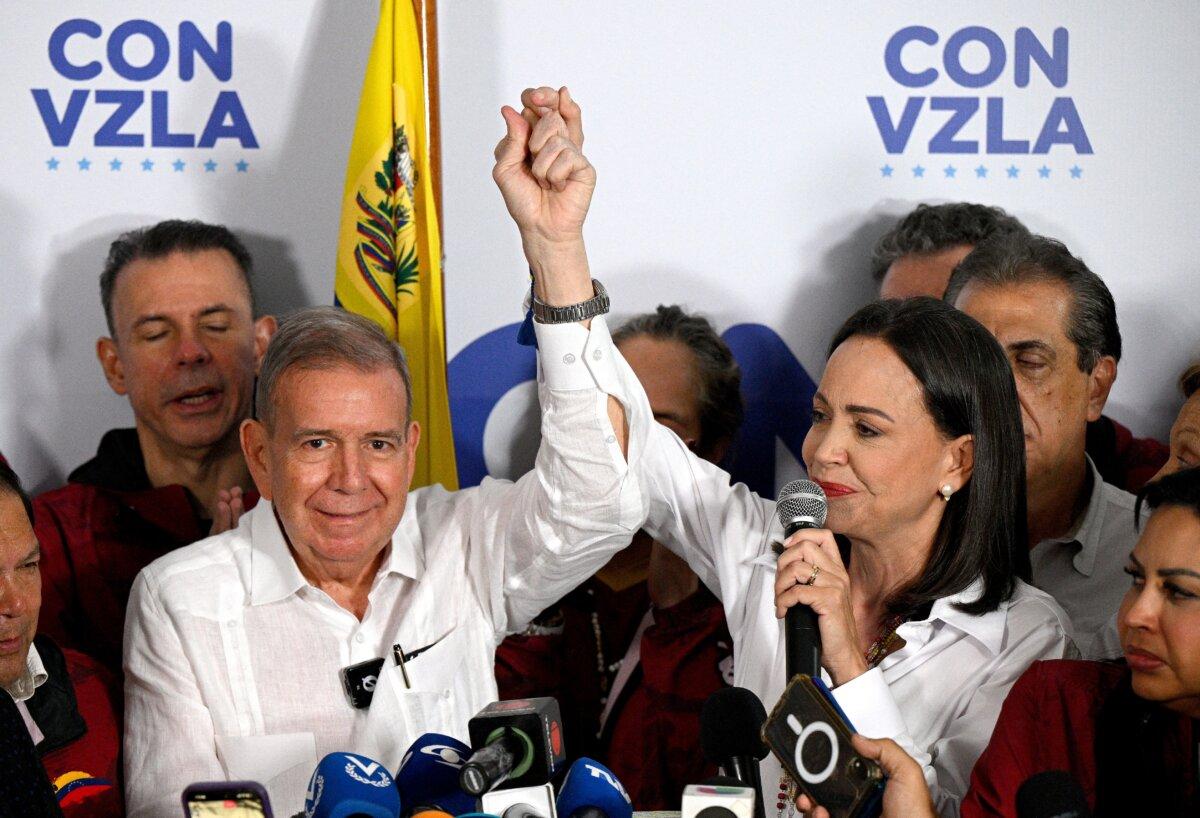 Venezuelan opposition leader María Corina Machado (R) talks to the media, accompanied by opposition presidential candidate Edmundo Gonzalez Urrutia, following the presidential election results in Caracas on July 29, 2024. (Federico Parra/AFP via Getty Images)