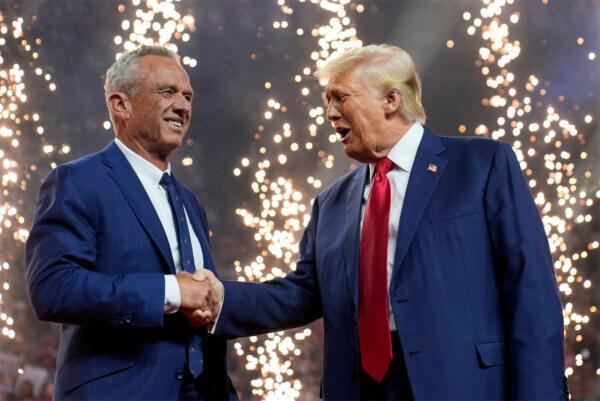Former President Donald Trump shakes hands with Independent presidential candidate Robert F. Kennedy Jr. at a campaign rally at the Desert Diamond Arena in Glendale, Ariz., on Aug. 23, 2024. (Evan Vucci/AP Photo)