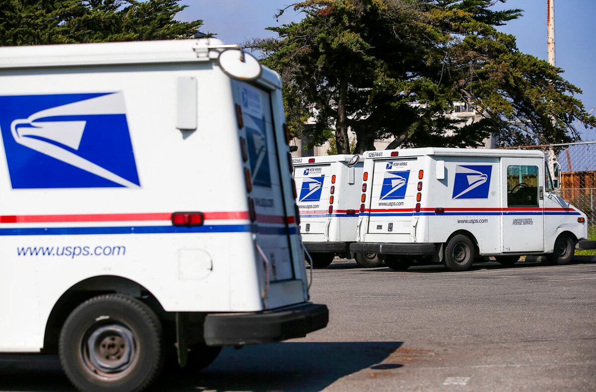 U.S. Postal Service mail vehicles in a file photograph. (Justin Sullivan/Getty Images)