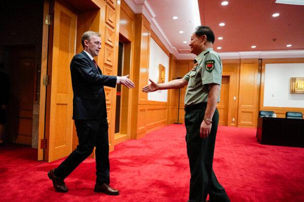 U.S. National Security Adviser Jake Sullivan (L) shakes hands with Zhang Youxia, vice chairman of China's Central Military Commission, before a meeting at the Bayi building in Beijing on Aug. 29, 2024. (Ng Han Guan/POOL/AFP via Getty Images)