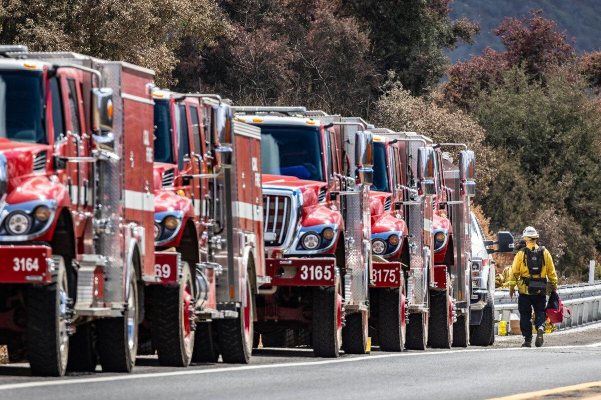 Cal Fire engines line the Ortega Highway in El Cariso Village, Calif., on Sep. 16, 2024. (John Fredricks/The Epoch Times)