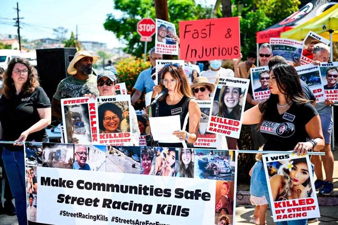 Lili Trujillo Puckett, founder of Street Racing Kills, speaks alongside local residents and supporters of the group during a protest on the increase in street racing takeovers in the Angelino Heights neighborhood of Los Angeles, on Aug. 26, 2022. (Patrick T. Fallon/AFP via Getty Images)