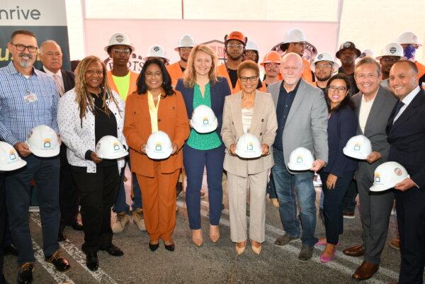 Speakers at the Thrive Living groundbreaking celebration (left to right): Costco Regional Administrative Manager Sean Mackin; Gina Fields, Chair, Empowerment Congress West Area Neighborhood Development Council; Los Angeles City Councilmember Heather Hutt; Assemblymember Buffy Wicks; Los Angeles Mayor Karen Bass; Western States Regional Council of Carpenters Executive Secretary Treasurer Frank Hawk; HACLA Board Chair Cielo Castro; CA Community Foundation President & CEO and LA4LA Working Group Member Miguel Santana; and Thrive Living Founder Ben Shaoul. (Courtesy of Ian Foxx)