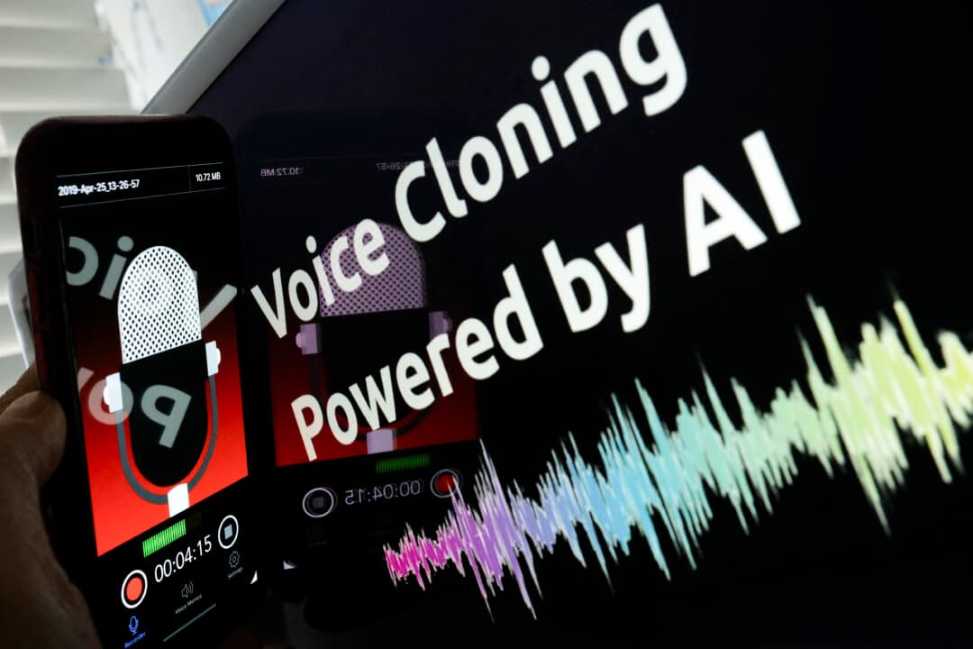 An illustration image shows a smartphone recording in front of a voice cloning screen. With the rise of sophisticated digital mimicry, industry insiders say wire fraud and identity theft are more convincing than ever when it comes to closing deals involving tens of thousands of dollars. (Chris Delmas/AFP via Getty Images)