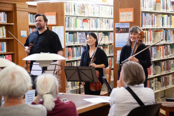 Dan Flanagan, Karen Shinozaki Sor, and Victoria Ehrlich stand after playing Wolfgang Amadeus Mozart’s "Serenade in C" in the Golden Gate Valley Libary, San Francisco, Calif., on Sept. 28, 2024. (Lear Zhou/The Epoch Times)
