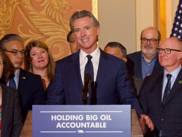 Gov. Gavin Newsom speaks at a press conference for the signing of Assembly Bill X2-1 at the Capitol in Sacramento on Oct. 14. (Travis Gillmore/The Epoch Times)