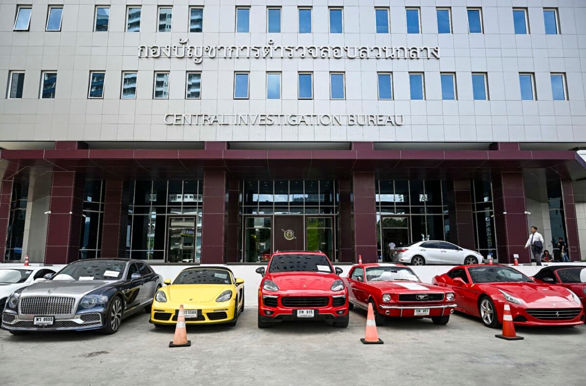 Rows of seized luxury cars are seen at the Central Investigation Bureau in Bangkok on Oct. 17, 2024. (Lillian Suwanrumpha/AFP via Getty Images)