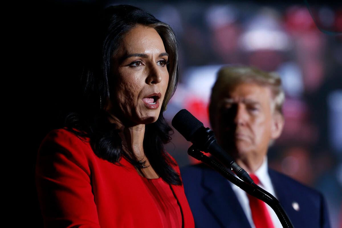Former U.S. Representative from Hawaii Tulsi Gabbard speaks as former U.S. President Donald Trump listens at a rally at the Greensboro Coliseum on Oct. 22, 2024, in Greensboro, North Carolina. (Anna Moneymaker/Getty Images)