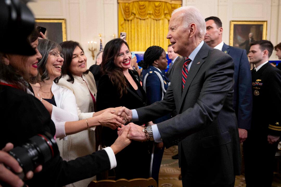 President Joe Biden greets attendees of the Small Business Adiministration (SBA) Women's Business Summit in the East Room of the White House in Washington on March 27, 2023. (Jim Watson/AFP via Getty Images)