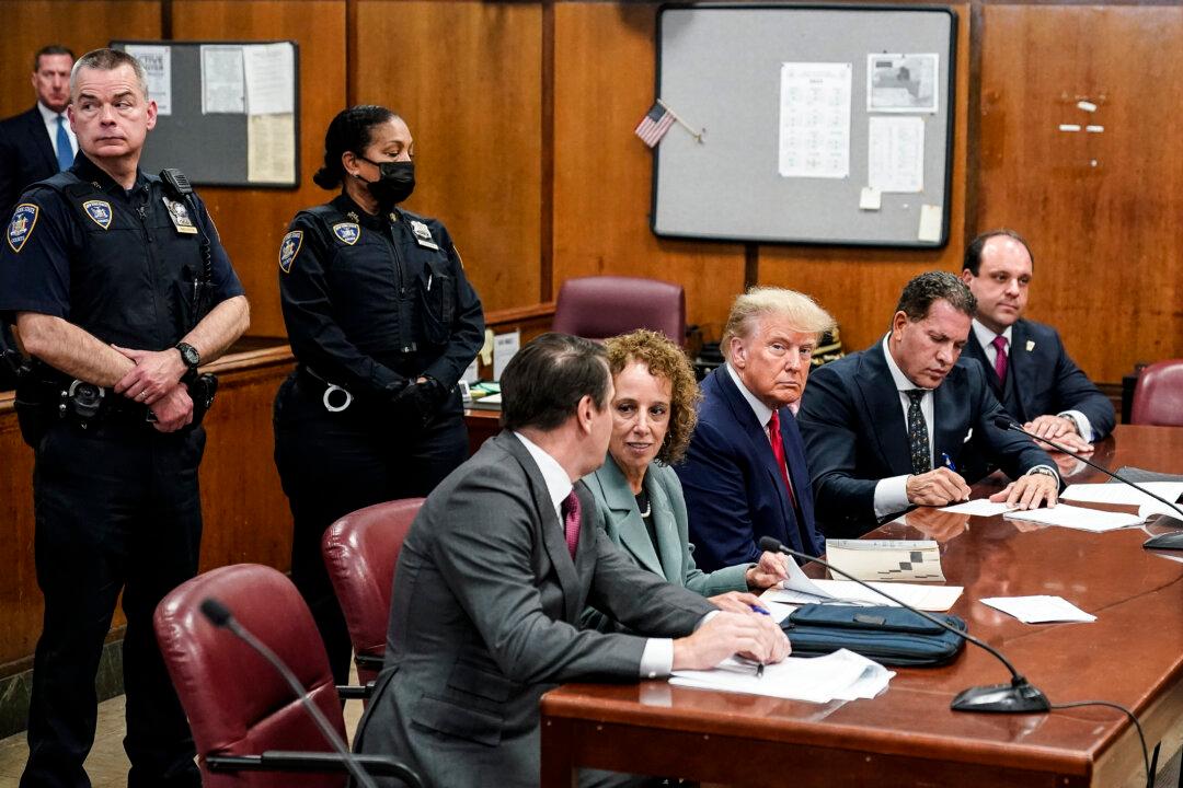 Former President Donald Trump sits at the defense table with his defense team in a Manhattan court during his arraignment in New York City on April 4, 2023. (Seth Wenig-Pool/Getty Images)