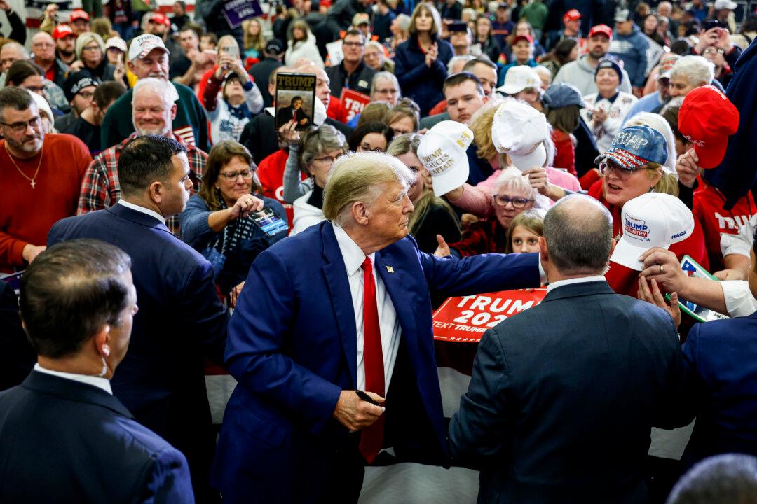 Republican presidential candidate, former President Donald Trump signs autographs for guests after speaking at a campaign rally in Mason City, Iowa, on Jan. 5, 2024. President Trump is campaigning across cities in Iowa in the lead up to the January 15 caucus for Iowa Republicans to select their party’s nominee for the 2024 presidential race. (Anna Moneymaker/Getty Images)