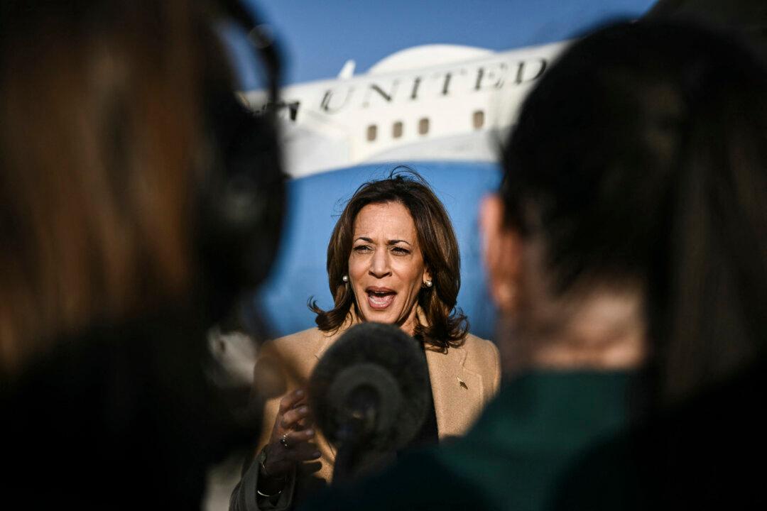 Vice President and Democratic presidential candidate Kamala Harris speaks to the press before boarding Air Force Two at Joint Base Andrews in Maryland on Oct. 12, 2024. (Brendan Smialowski/POOL/AFP via Getty Images)