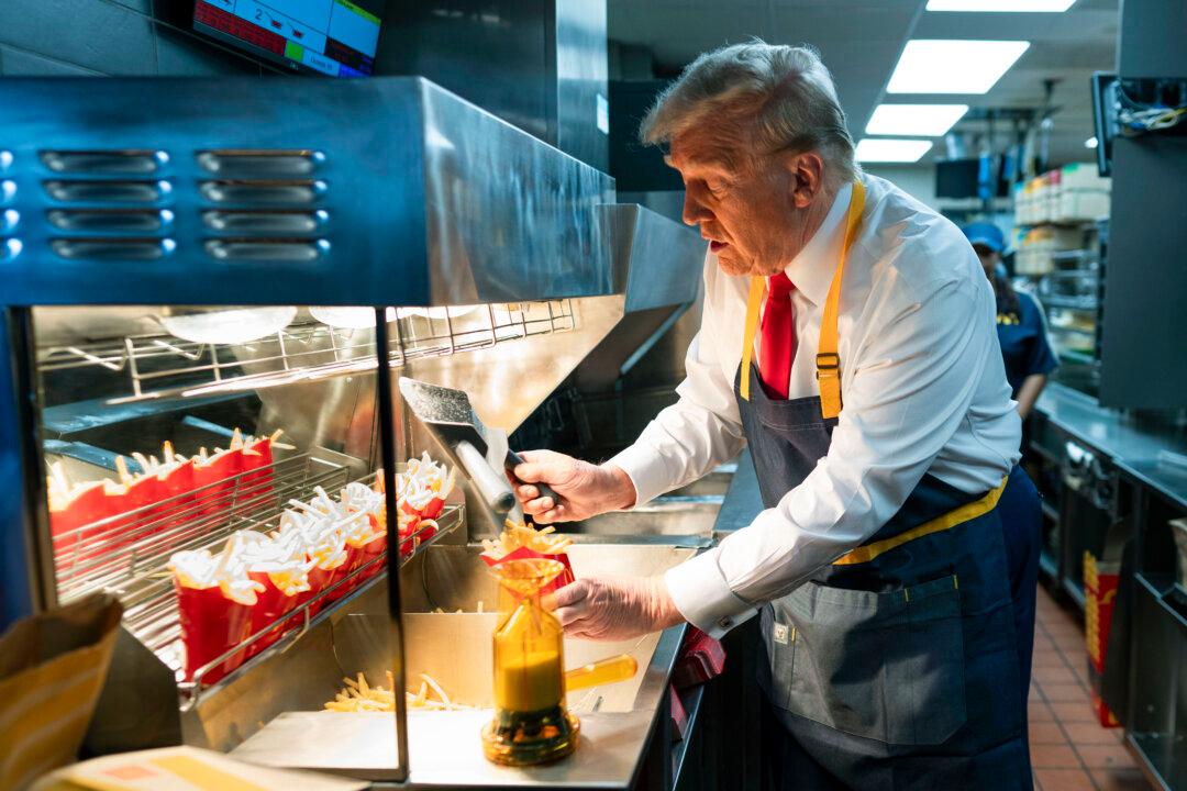 Republican presidential nominee, former President Donald Trump works behind the counter during a campaign event at McDonald's restaurant in Feasterville-Trevose, Pa., on Oct. 20, 2024. (Doug Mills-Pool/Getty Images)