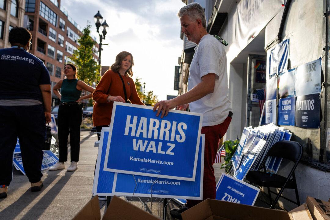 Volunteers assemble Harris/Walz yard signs outside of the Democratic Party campaign office in Allentown, Pa., on Oct. 31, 2024. (Samuel Corum/AFP via Getty Images)