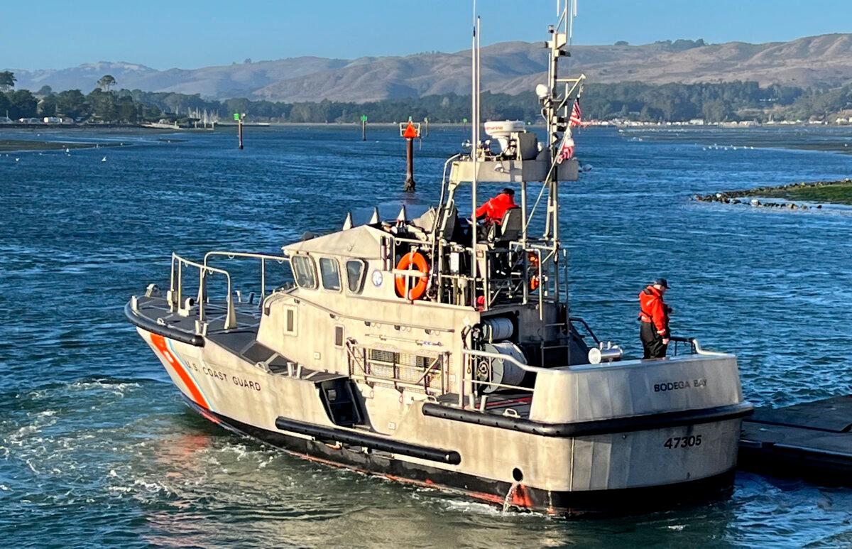 A U.S. Coast Guard crew moors a boat to a pier in Bodega Bay, Calif, on Nov. 3, 2024, after searching for a group of boaters that went missing near Bodega Bay. (United States Coast Guard via AP)