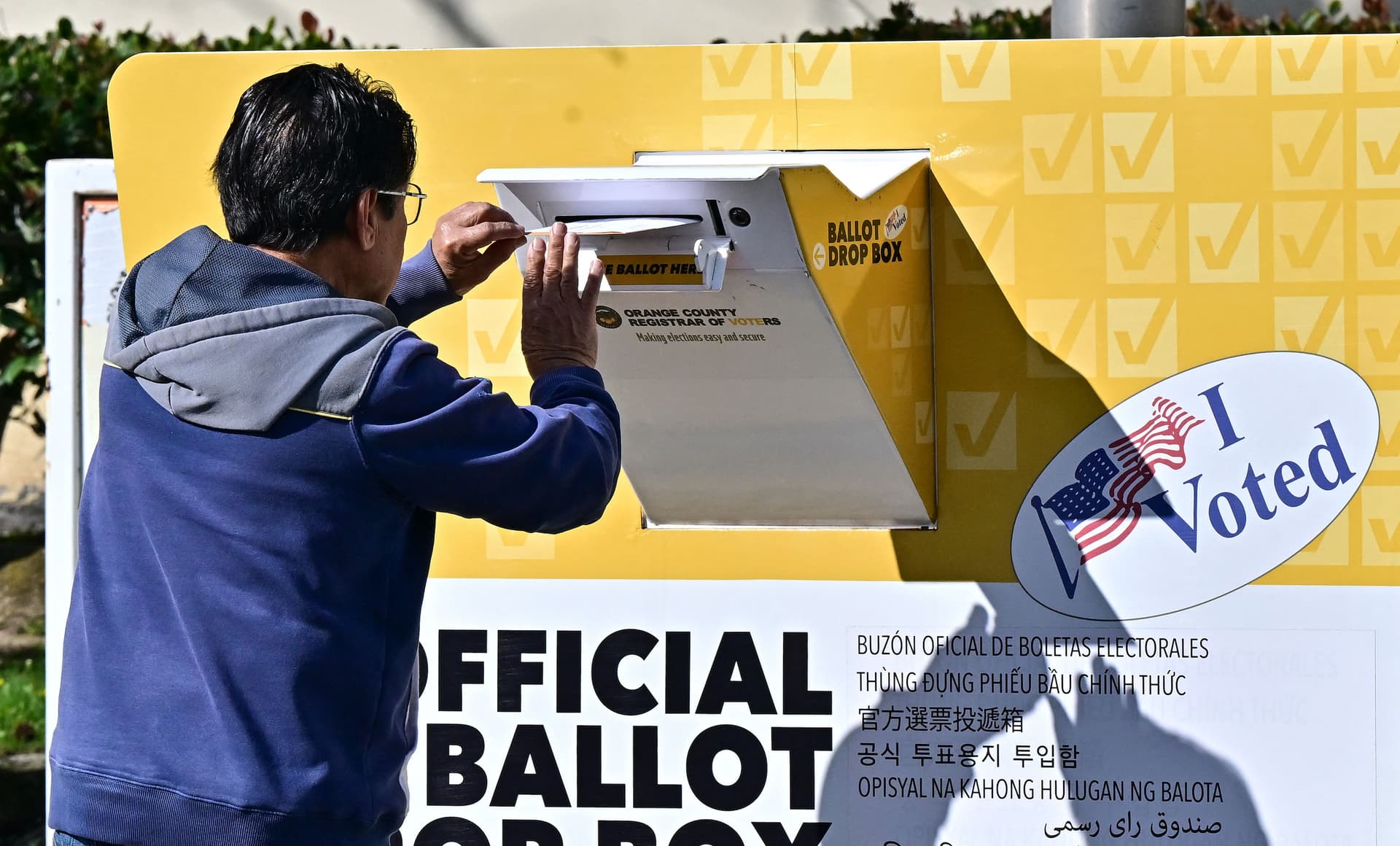 A man drops his ballot into a ballot box at the Orange County Registrar in Santa Ana, Calif., on March 5, 2024. (Frederic J. Brown/AFP via Getty Images)