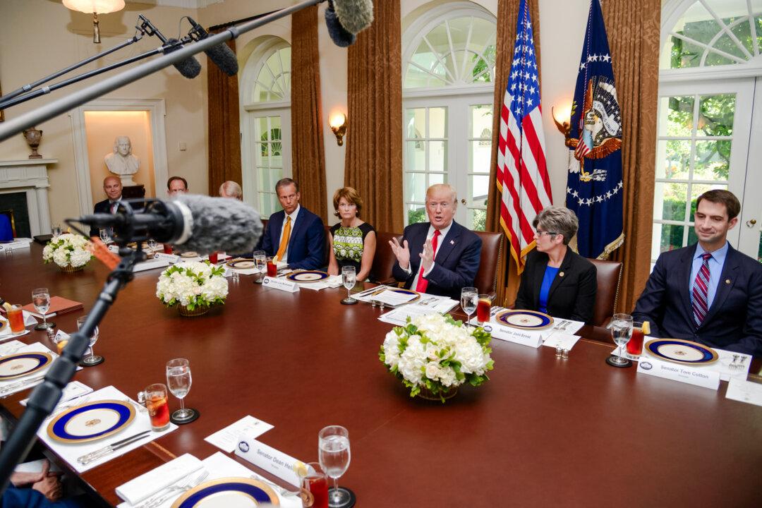 President Donald Trump hosts a working lunch with members of Congress, including (L–R) White House Director of Legislative Affairs Mark Short and Sens. Pat Toomey (R-Pa.), Rob Portman (R-Ohio), John Thune (R-S.D.), Lisa Murkowski (R-Alaska), Joni Ernst (R-Iowa), and Tom Cotton (R-Ark.) at the White House on June 13, 2017. (Mike Theiler-Pool/Getty Images)