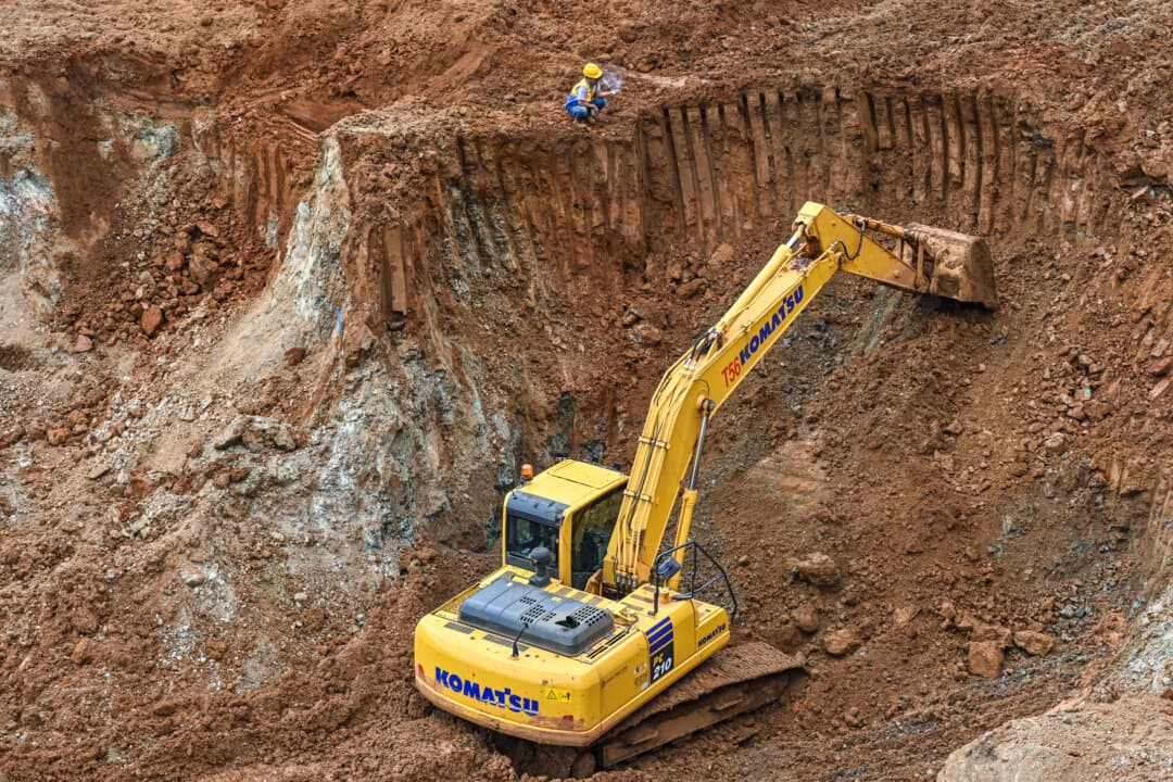 Workers use excavators during an exploration for nickel ore, a critical component used in electric vehicle batteries, on Wawonii Island in southeast Sulawesi, Indonesia. (Adek Berry/AFP via Getty Images)
