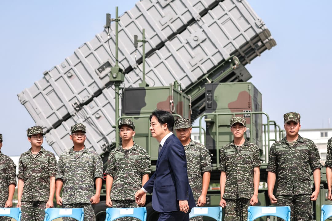 Taiwan President Lai Ching-te walks past soldiers at a naval base following Chinese military drills in Taoyuan on Oct. 18, 2024. (I-Hwa Cheng/AFP via Getty Images)