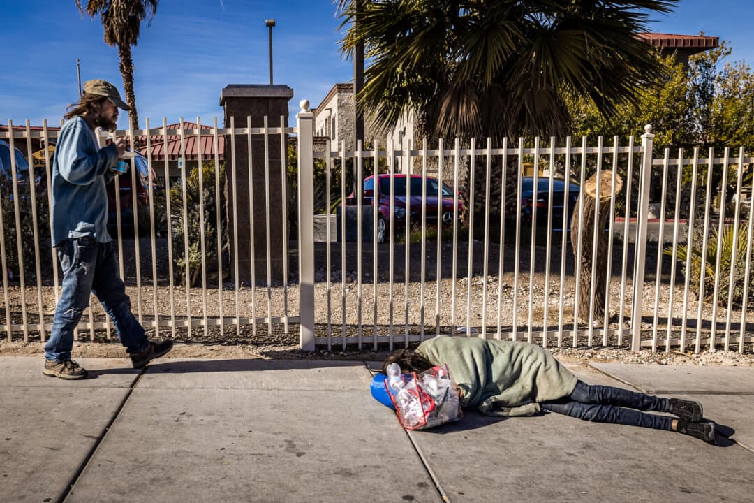 A homeless person sleeps on the street in Las Vegas on Nov. 11, 2024. (John Fredricks/The Epoch Times)