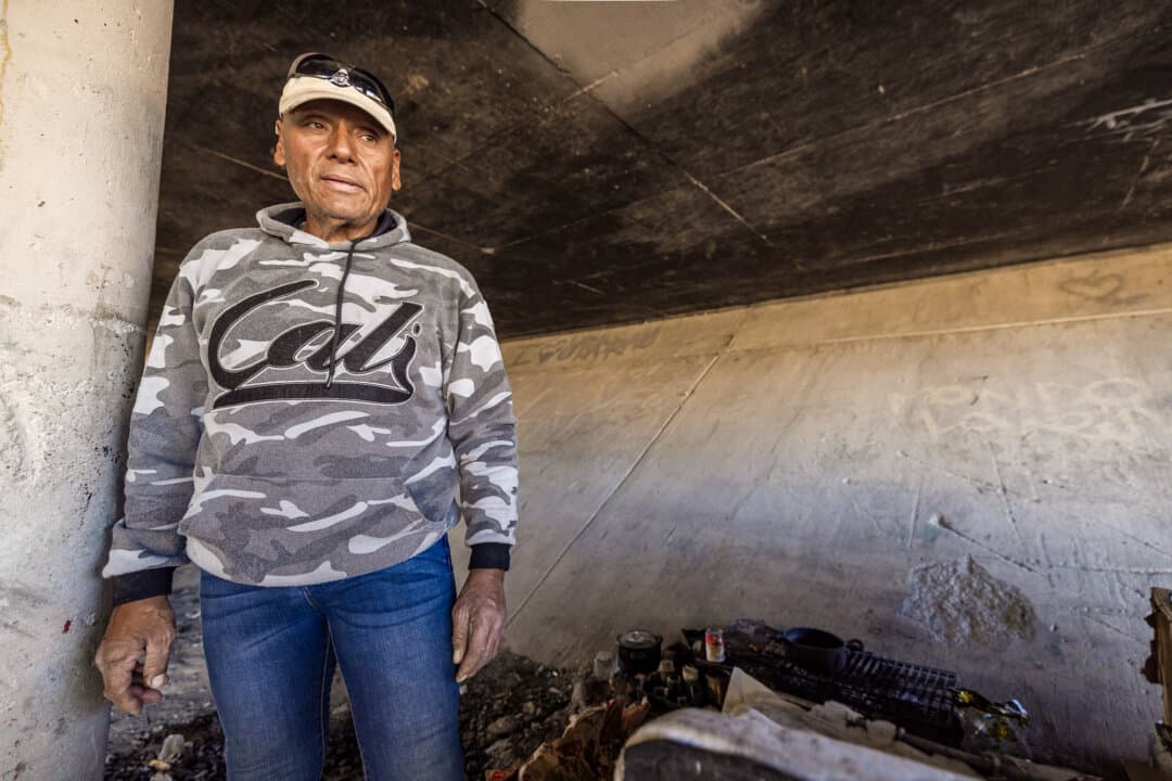 “Carlos,” a homeless person, at a sewage tunnel where he sometimes sleeps in Las Vegas on Nov. 14, 2024. (John Fredricks/The Epoch Times)