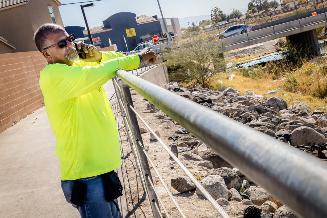 Louis Lacey Jr., director of HELP of Southern Nevada, takes a phone call while working in the field in Las Vegas on Nov. 14, 2024. (John Fredricks/The Epoch Times)