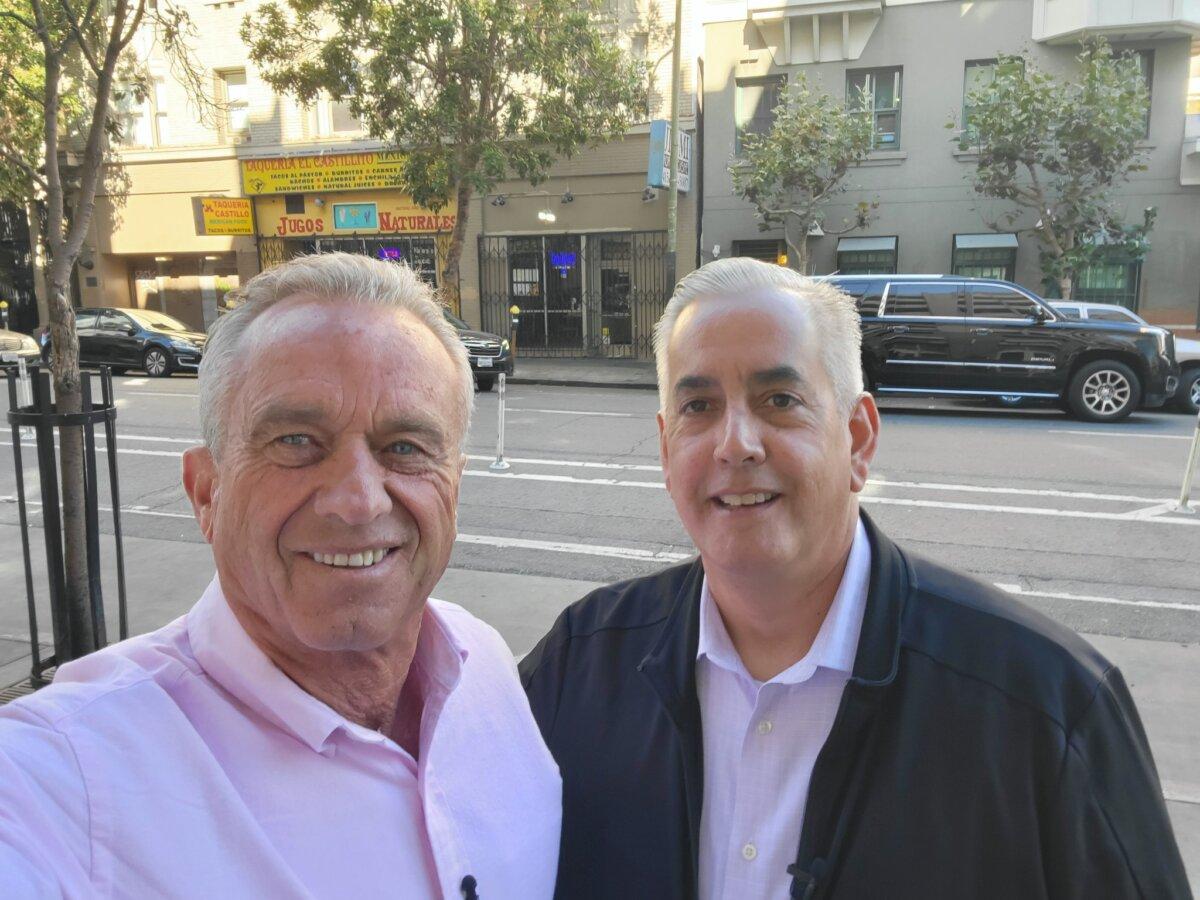 Tom Wolf, a recovery advocate based in San Francisco, with Robert F. Kennedy Jr. in San Francisco’s Tenderloin district in October 2023. (Courtesy of Tom Wolf)