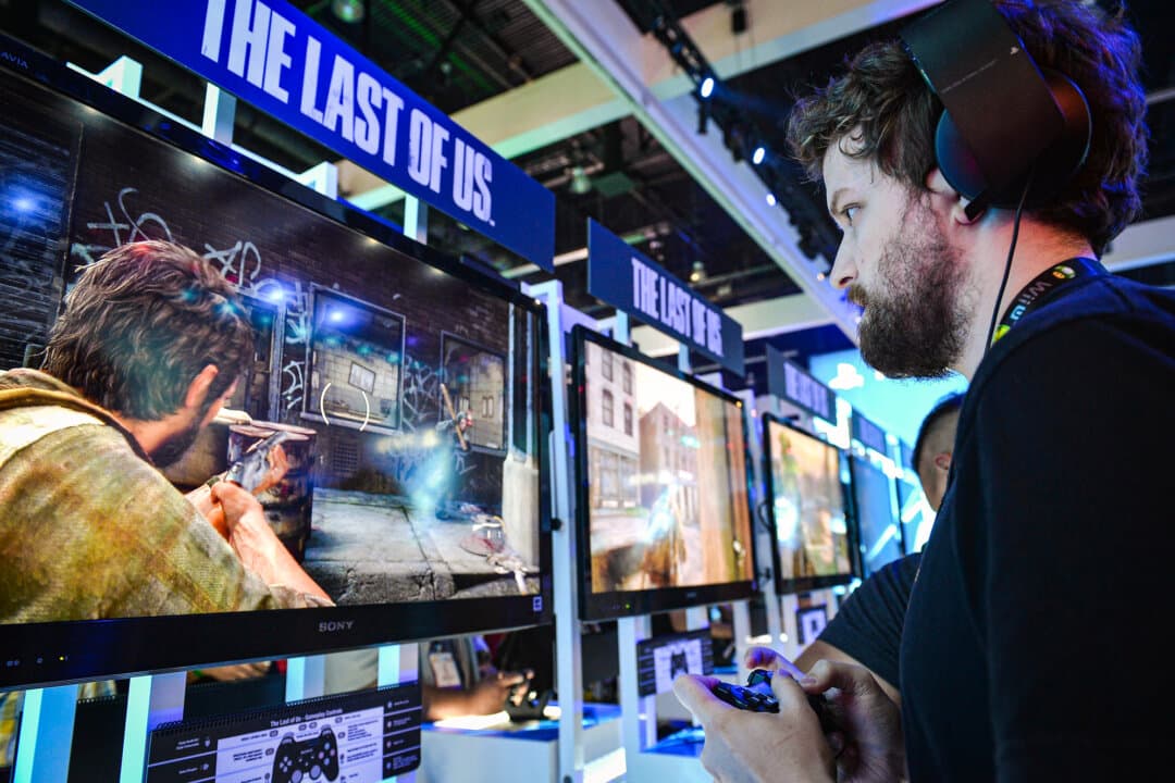 Fans try a PlayStation 4 game at the E3 gaming and technology conference at the Los Angeles Convention Center on June 11, 2013. (Alberto E. Rodriguez/Getty Images)